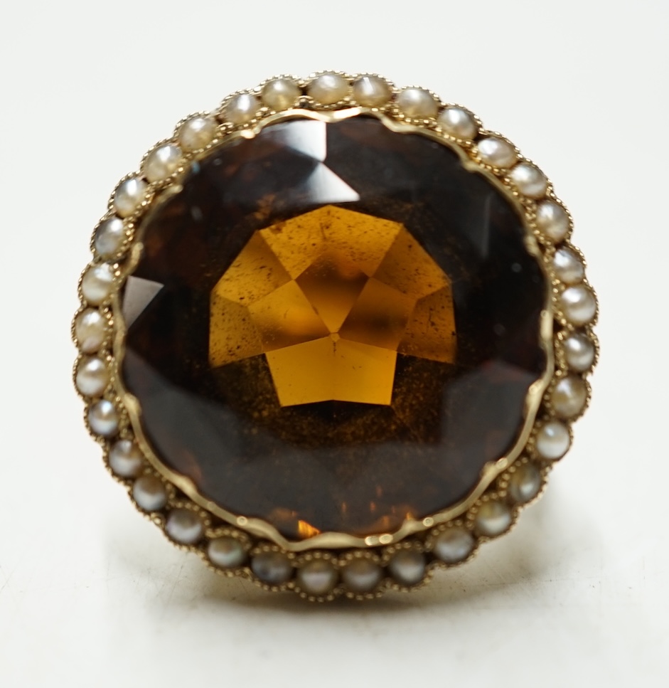 A yellow metal, citrine and seed pearl cluster set circular dress ring, size L, gross weight 10.8 grams. Condition - fair